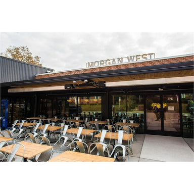 Detroit Radiant DSRL Gas Patio Heater installed in an outdoor seating area with tables and chairs. 