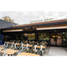 Detroit Radiant DSRL Gas Patio Heater installed in an outdoor seating area with tables and chairs. 