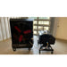Black PolarCool Pro 36 evaporative cooler attached via hose to Water Cart, both on wheels, in a room with a garage door. 